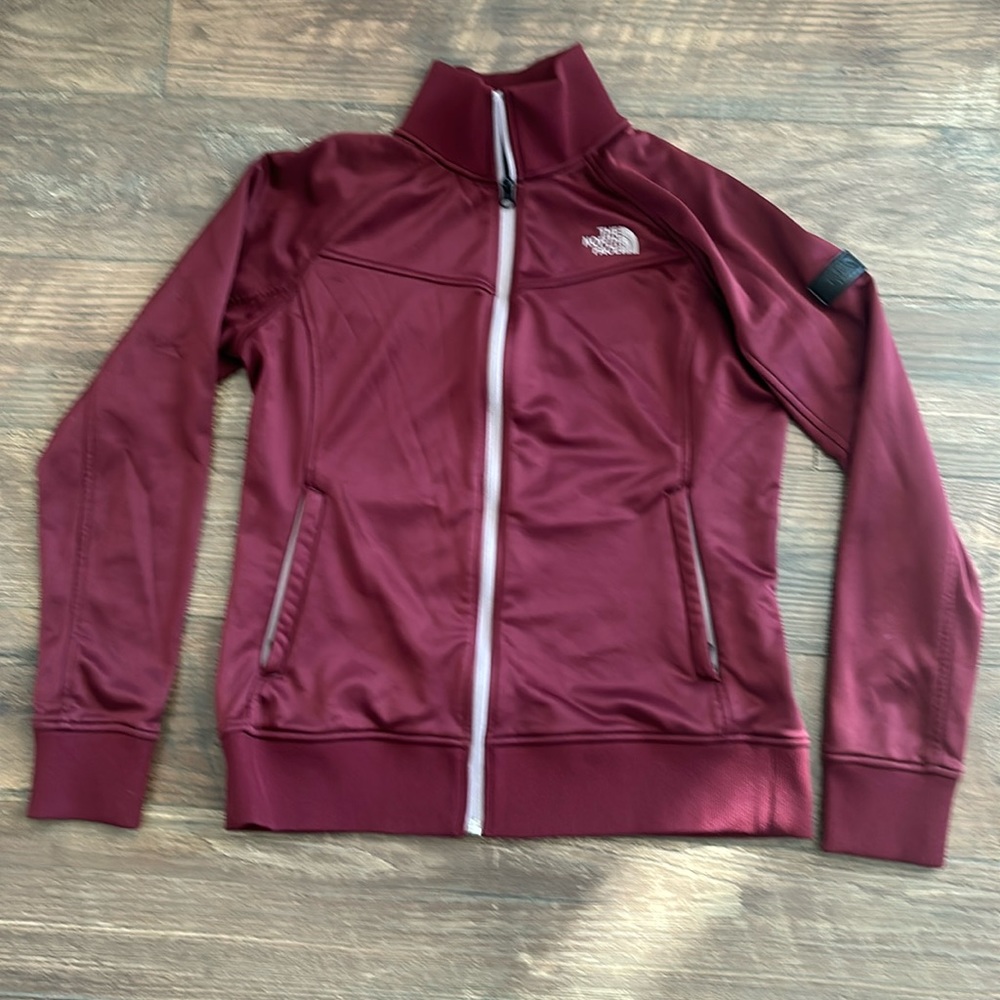 The North Face women’s athletic jacket, like new condition, very warm